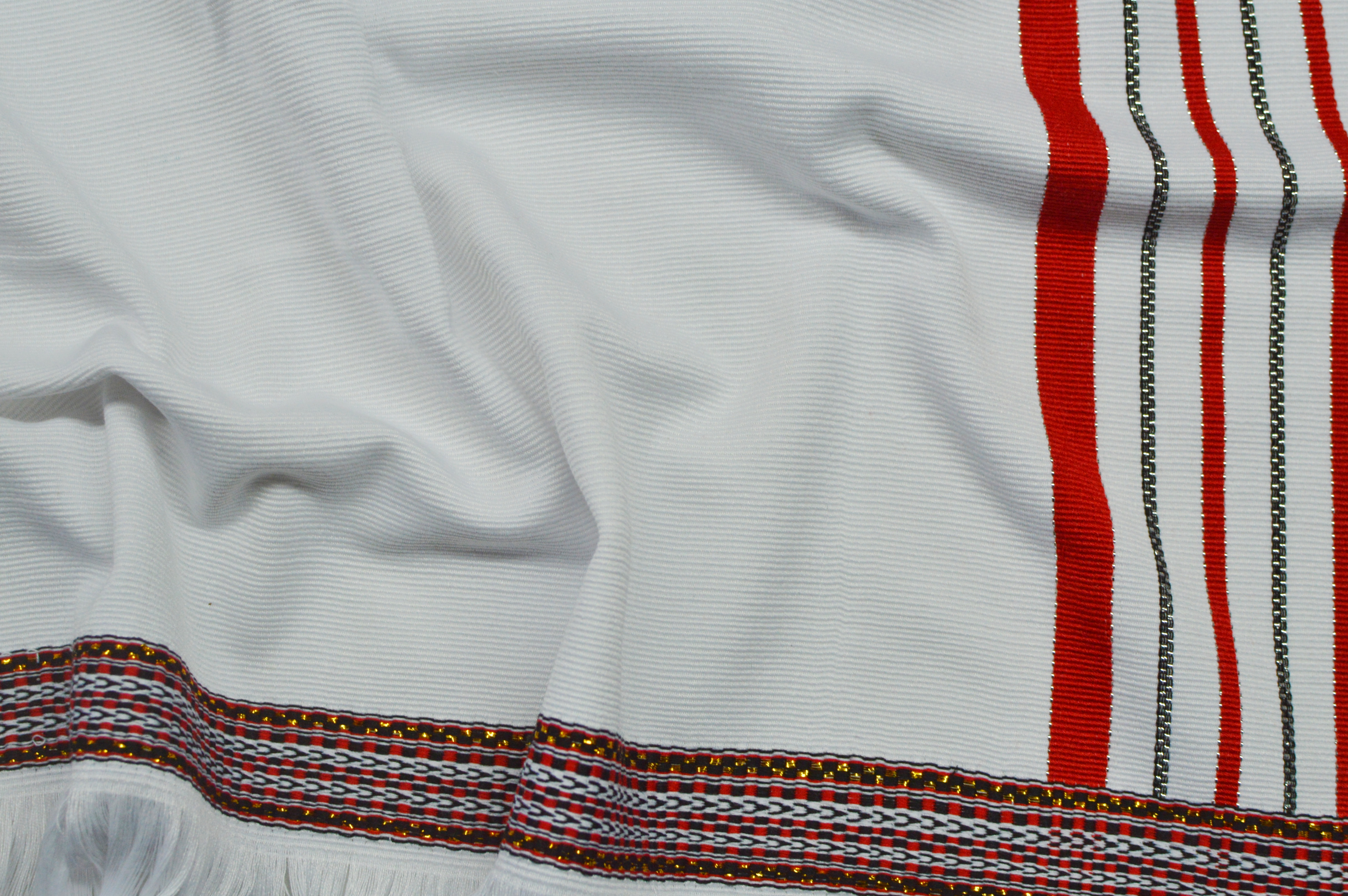 White sarong with red border