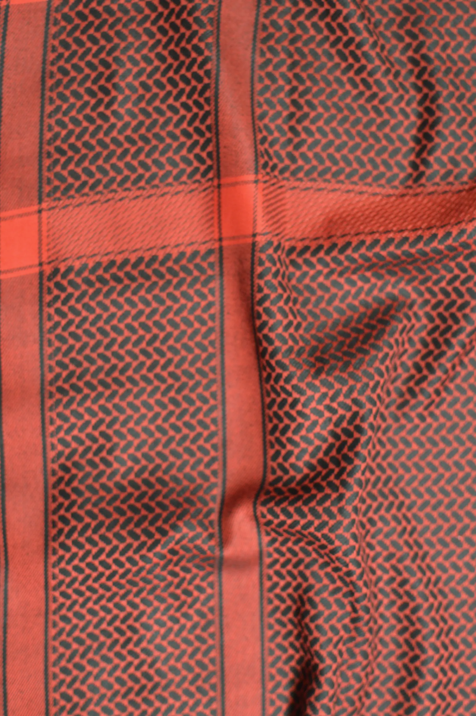 Red and black patterned keffiyeh